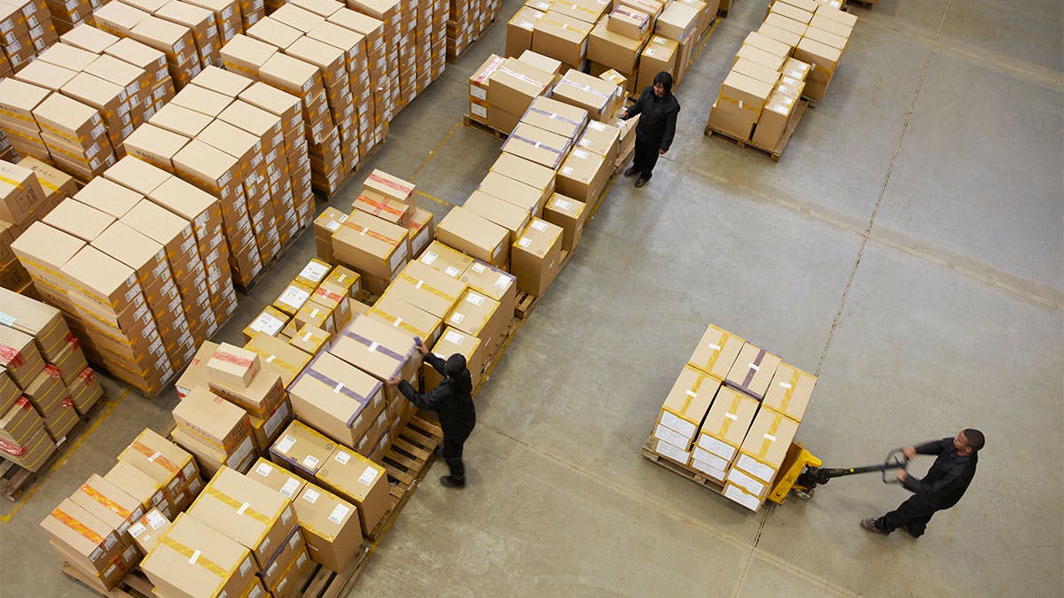 Men moving shipping boxes